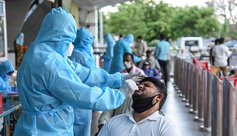 Health officials collecting swab samples. (Photo| EPS/Ashok Kumar)