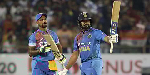 Rohit Sharma (R) celebrates a fifty as Shikhar Dhawan looks on. (File photo| AP)