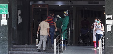 Visitor being scanned by thermal device at Sir Ganga Ram Hospital in New Delhi on Saturday. (Photo | Anil Shakya/EPS)