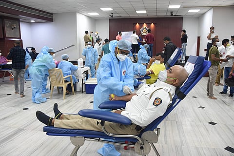 Police personnel donate blood after Maharashtra CM Uddhav Thackeray appealed donors to come forward due to the shortage of blood for COVID-19 and non-COVID patients in Mumbai Saturday June 6 2020. (Photo | PTI)