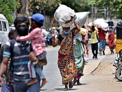 Odisha-based migrants on their way to Central to board the train in Chennai on Sunday. (Photo | P Jawahar, EPS)