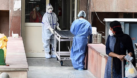 Medical workers in PPE gear outside the COVID-19 ward at a hospital. (Photo | Parveen Negi/EPS)