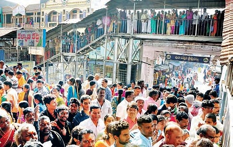 Photo of devotees await in long queues for having darshanam at Sri Raja Rajeshwara Swamy temple, in Vemulawada from two years ago. | Express Photo