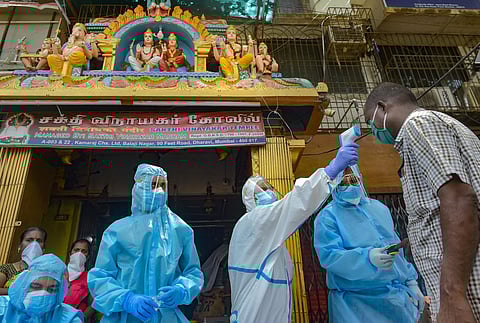 Volunteers conduct thermal screening at Dharavi during the ongoing COVID-19 lockdown in Mumbai Sunday June 7 2020. (Photo | PTI)