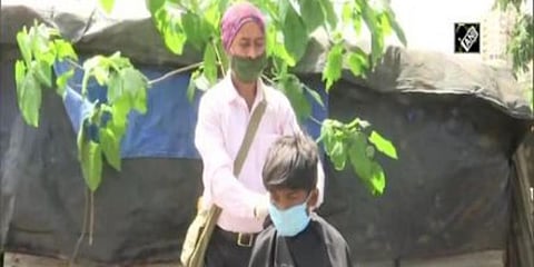 Ravindra Birari, hairdresser lives in Titwala and runs his own salon in Bhandup, Mumbai for many years. (Photo | ANI)