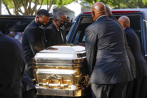 George Floyd's casket is loaded into a hearse after being brought out of Fountain of Praise church following a public visitation Monday, June 8, 2020, in Houston. Floyd died May 25 after being restrained by Minneapolis police. (Photo | AP)