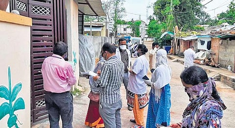 Civic body officials conducting household survey at Nayapalli in Bhubaneswar on Tuesday I EXPRESS