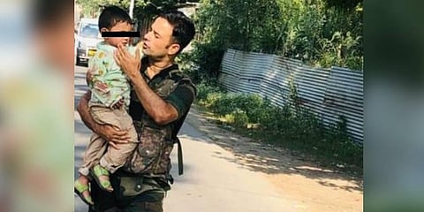 Toddler rescued after his grandfather was killed in cross firing between militants and jawans in Jammu and Kashmir. (Photo | IANS)