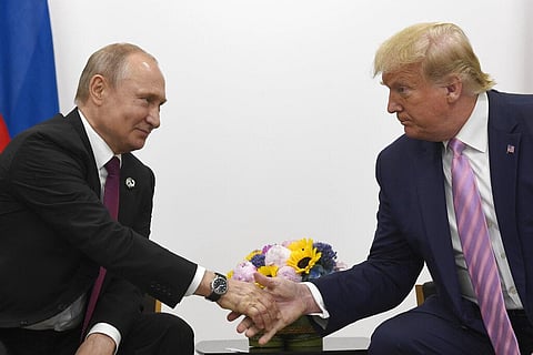 In this June 28, 2019, file photo President Donald Trump, right, shakes hands with Russian President Vladimir Putin, left, during a bilateral meeting on the sidelines of the G-20 summit in Osaka, Japan. For the past three years, the administration has car