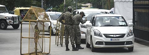 Marshals check ID cards of visitors at the BBMP head office | vinod Kumar T