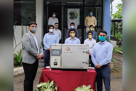 Officials of Chakra Innovation with Chakr DeCoV device. (Photo | EPS)