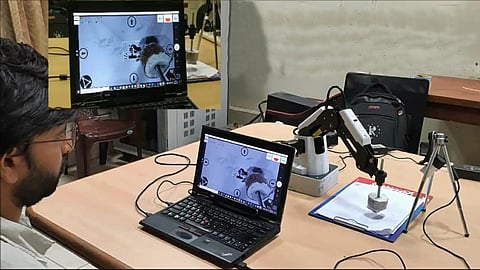 Gaze-controlled robotic arm to aid speech and motor impaired