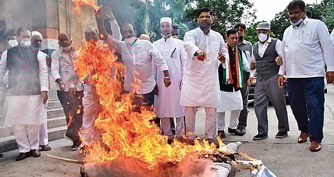 Congress Committee Minorities Wing activists burn the effigy of Chief Minister K Chandrasekhar Rao at Gandhi Bhavan in Hyderabad on Saturday, against the demolition of two mosques and a temple at the Secretariat complex