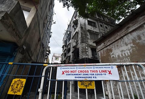 Barricades are placed on a road in front of an apartment at Chakraberia after the state government announced total lockdown in all containment zones from July 9 in Kolkata Wednesday July 8 2020. (Photo | PTI)