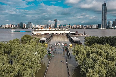 This overview taken on July 8, 2020 shows streets and walkways that lead to a dock inundated by floodwaters from the swollen Yangtze River. (Photo| AFP)