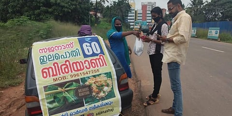 Sajana Shaji selling biriyani to customers.