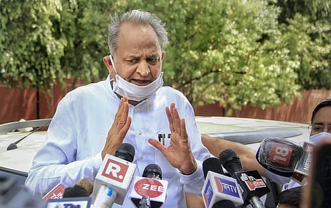 Rajasthan Chief Minister Ashok Gehlot addresses the media after visiting the State Governor at his residence in Jaipur Tuesday. (Photo | PTI)