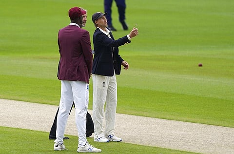 England's captain Joe Root, right, flips the coin at toss before the start of the first day of the second cricket Test match between England and West Indies at Old Trafford in Manchester, England, Thursday, July 16, 2020. (Photo | AP)
