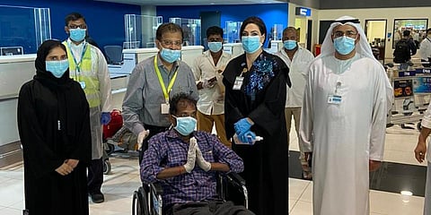 Odnala Rajesh (in wheelchair) leaves for Hyderabad from Dubai. (Photo| Twitter)