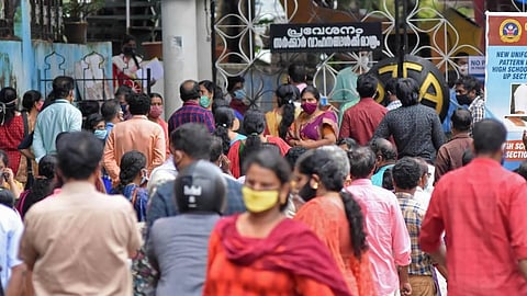 Parents of candidates sitting for the KEAM entrance examination at Cotton Hill GHSS in Thiruvananthapuram gathered near the school gate in violation of COVID-19 protocol on Thursday. (Photo | BP Deepu/EPS)