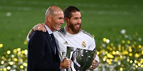Real Madrid gaffer Zinedine Zidane and captain Sergio Ramos pose with the La Liga trophy (Photo | AFP)