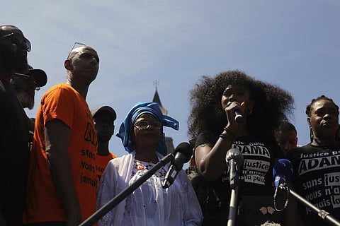 Assa Traore, sister of Adama Traore, speaks to reporters ahead of a march to mark the fourth anniversary of the death of her brother, a Black man in police custody, whose case has mobilized broad anger against police brutality and racial injustice, in Bea