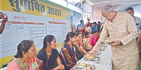 Women being served food by Chhattisgarh CM Bhupesh Baghel