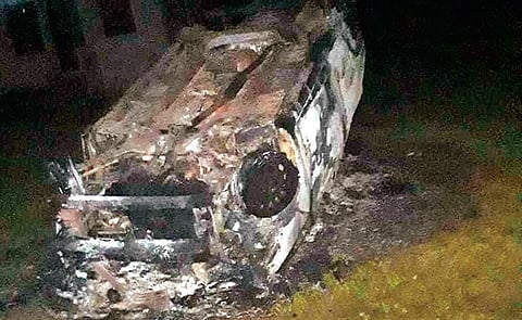 The charred vehicle of the OIC of Krishnanandpur police outpost. (photo| EPS)