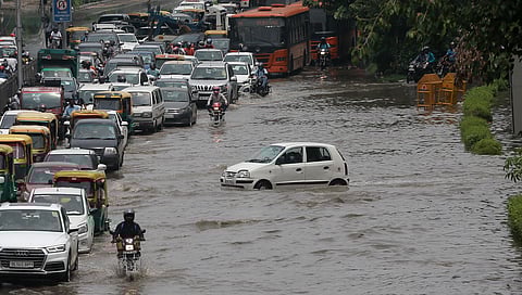 Traffic on a waterlogged road at ITO following rains in New Delhi. (Photo | Shekhar Yadav, EPS)
