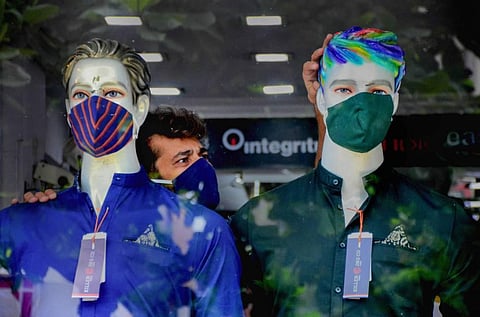 Mannequins wearing masks put on display in a shop after the extended lockdown was lifted by Navi Mumbai Municipal Corporation NMMC in the non-containment zones during Unlock 2.0 at Vashi in Navi Mumbai Monday July 20 2020. (Photo | PTI)