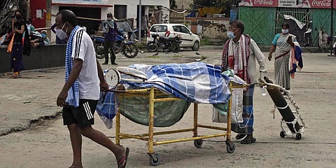 Family members without permission moving their COVID-19 positive relative's dead body from Nalanda Medical College and Hospital in Patna. (File photo| ANI)