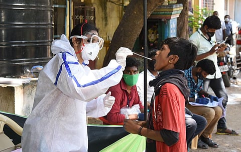 Healthcare workers carrying out Covid-19 testing at kiosks in Madurai. (Photo | EPS/K.K. Sundar)