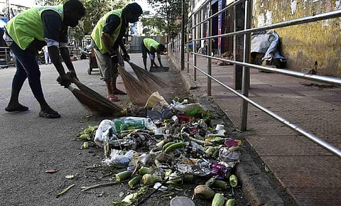 BBMP workers cleaning the Avenue Road in Bengaluru. (Photo | Vinod Kumar T, EPS)