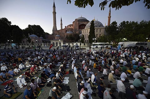 Muslims offer prayers outside the Byzantine-era Hagia Sophia following Turkey's Council of State's decision that paved the way the landmark monument be turned from a museum into a mosque. (Photo | AP)