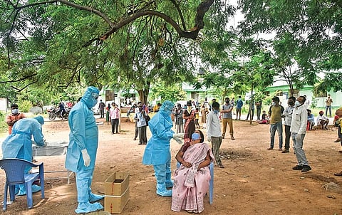 Health workers test people for Covid-19 at the Ibrahimpatnam Government Hospital in Hyderabad. (PHOTO | VINAY MADAPU, EPS)