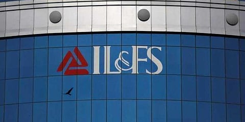 A bird flies next to the logo of IL&FS. (Infrastructure Leasing and Financial Services Ltd.) installed on the facade of a building at its headquarters in Mumbai, September 25, 2018. (Photo | Reuters)