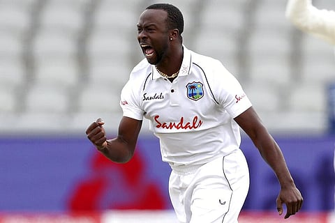 West Indies' Kemar Roach celebrates the dismissal of England's Dom Sibley during the first day of the third cricket Test match between England and West Indies. (Photo | AP)