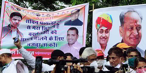 Cross mark is seen on the picture of Sachin Pilot in a poster during a protest by Congress party against BJP in Jaipur. (File photo| ANI)