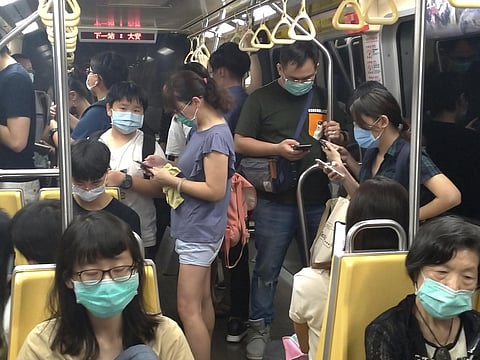 People wear face masks to protect against the spread of the coronavirus. (Photo | AP)