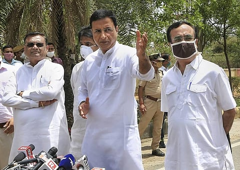 Senior Congress leaders Randeep Surjewala (C) Ajay Maken (R) and Avinash Pandey (L) during a press conference after a MLAs' meeting at a hotel in Jaipur. (File | PTI)