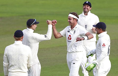 England's Stuart Broad, center, celebrates with teammates the dismissal of West Indies' John Campbell. (Photo | AFP)