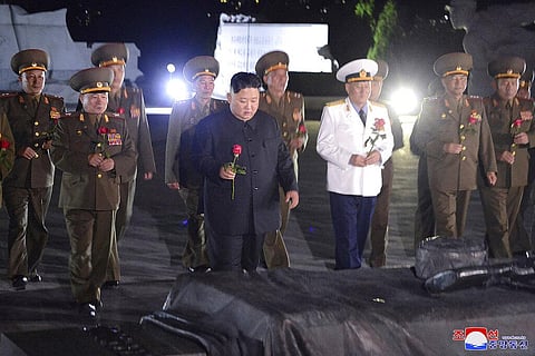 North Korean leader Kim Jong Un, center, with military officers in uniforms prepares to lay a flower to the Fatherland Liberation War Martyrs' Cemetery in Pyongyang, North Korea (Photo | AP)