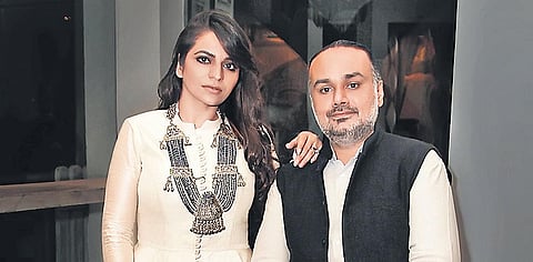 Rimple and Harpeet Narula; (below) complimentary masks with every garment from the Karawan collection