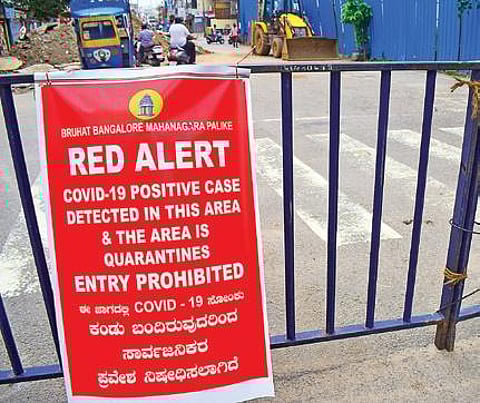 A poster announces sealing down of an area near JC Road in Bengaluru on Tuesday | Pandarinath b