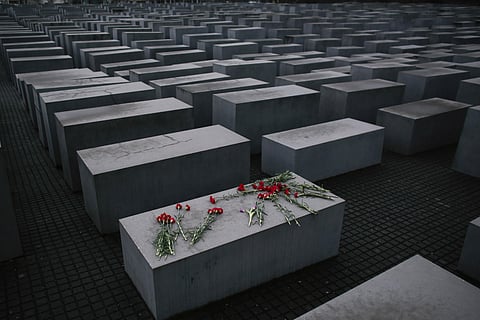 In this January 27, 2015 file photo, flowers lay on a concrete slab of the Holocaust Memorial. (Photo | AP)