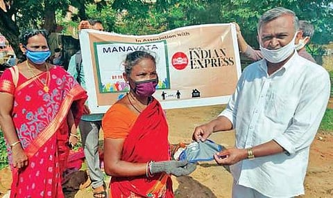Manavata By Friends, in association with The New Indian Express, distributes face masks to vendors in Vijayawada on Tuesday | express