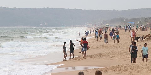 People seen enjoying themselves at Candolim Beach without wearing masks and following social distancing orders in Goa amid coronavirus pandemic. (Photo| IANS)