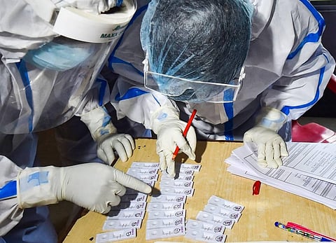 Health workers arrange samples for COVID-19 rapid antigen testing in Kolkata Thursday July 30 2020. (Photo | PTI)