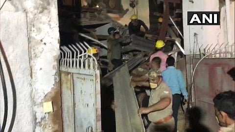 Rescue operations underway at the building collapse site in Noida. (Photo | Twitter/ANI)