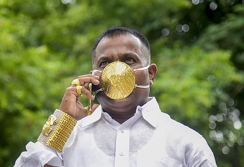 Shankar Kurhade a businessman wears a protective mask made of gold during Unlock 2.0 to curb the spread of coronavirus disease in Pune district Saturday July 4 2020. (Photo | PTI)